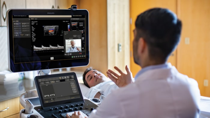 Clinician in real time remote consultation with a colleague during an ultrasound exam